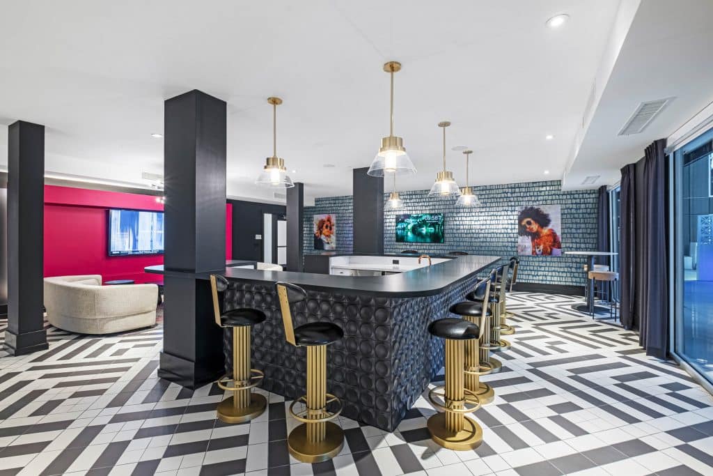 Furnished clubroom with bar table and chairs