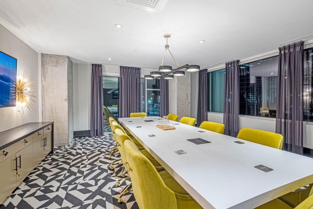 Furnished office with large table and chairs